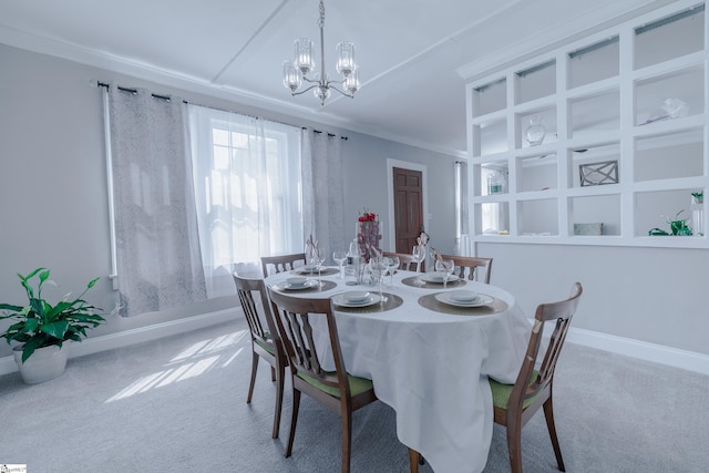 carpeted dining space featuring a notable chandelier and ornamental molding