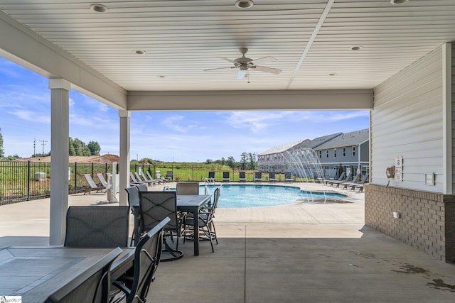 exterior space with ceiling fan and a patio area