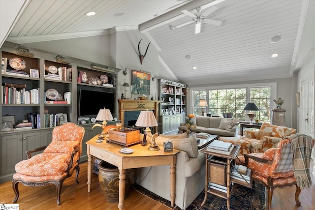 living room featuring light hardwood / wood-style flooring, vaulted ceiling with beams, ornamental molding, ceiling fan, and wooden ceiling