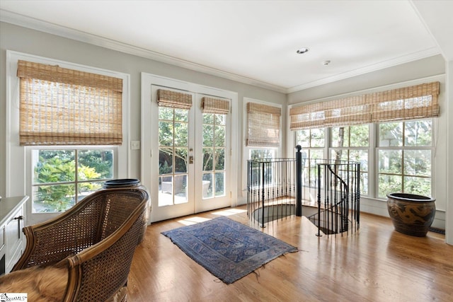 sunroom / solarium featuring french doors