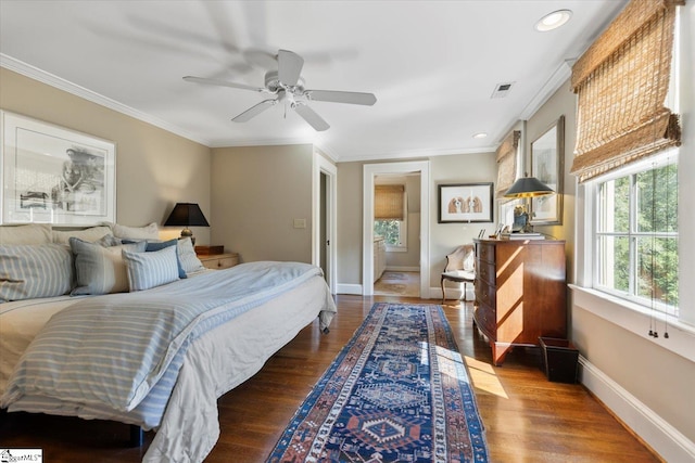 bedroom featuring ceiling fan, dark hardwood / wood-style floors, and ornamental molding