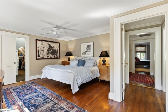 bedroom with ceiling fan, ornamental molding, a closet, and dark hardwood / wood-style flooring