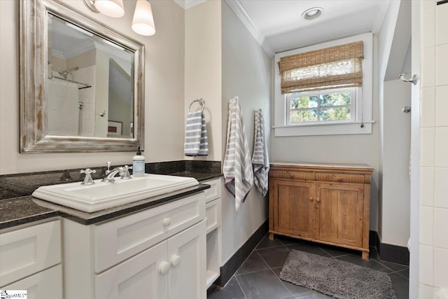 bathroom featuring ornamental molding, tile patterned flooring, walk in shower, and vanity