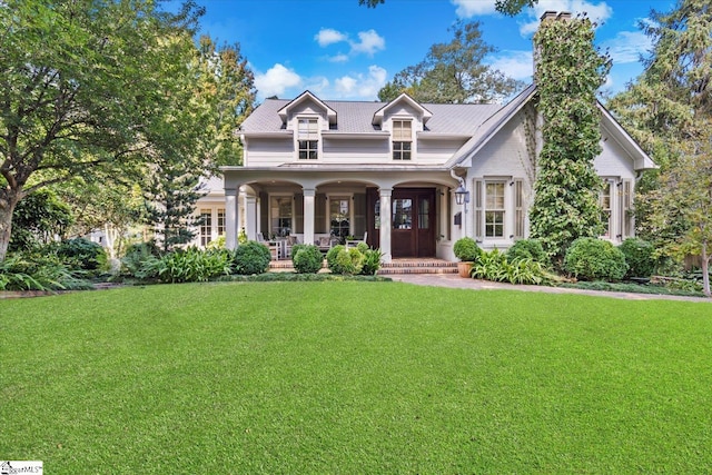 view of front of property featuring a porch and a front lawn