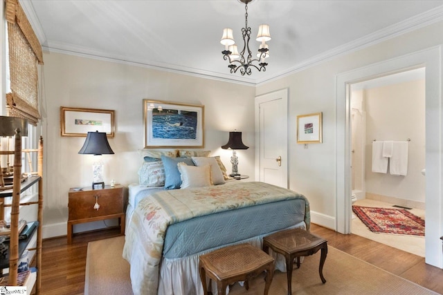 bedroom featuring ornamental molding, connected bathroom, hardwood / wood-style floors, and a chandelier