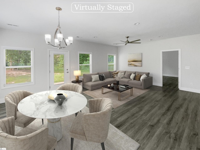 interior space with ceiling fan with notable chandelier and dark wood-type flooring