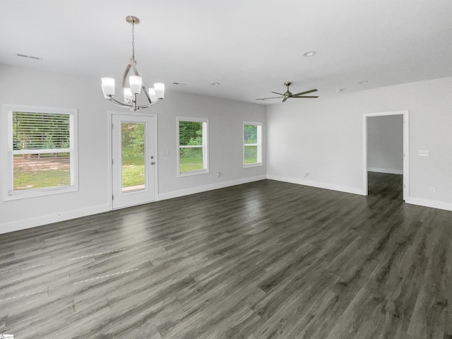 unfurnished living room featuring ceiling fan with notable chandelier and dark hardwood / wood-style floors