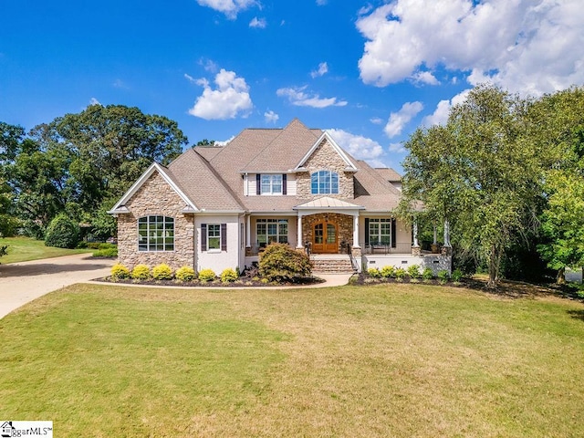 craftsman house featuring a front lawn and covered porch