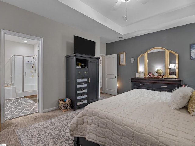 bedroom featuring connected bathroom, ceiling fan, and light colored carpet