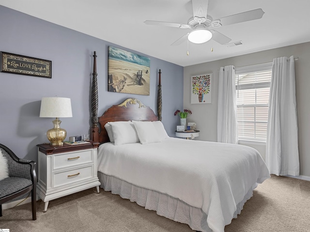 bedroom featuring light carpet and ceiling fan