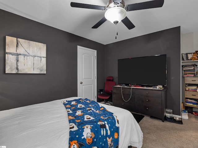 bedroom featuring ceiling fan and carpet