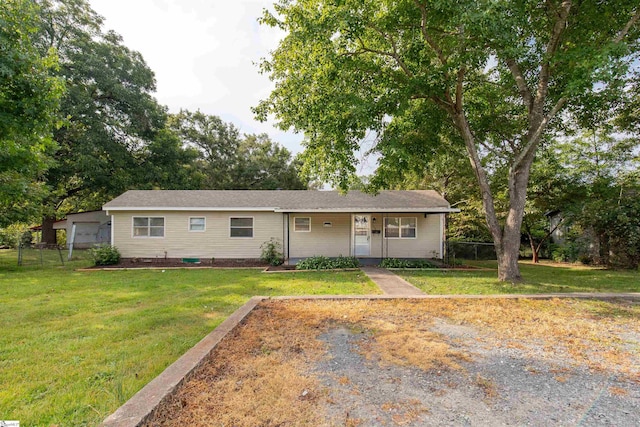 ranch-style house featuring a front lawn