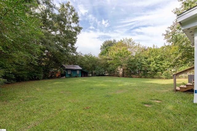 view of yard with a storage unit and central AC