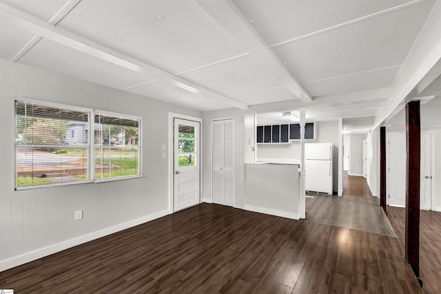 unfurnished living room featuring dark hardwood / wood-style floors