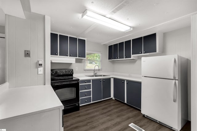 kitchen with black range with electric stovetop, white refrigerator, dark hardwood / wood-style floors, and sink