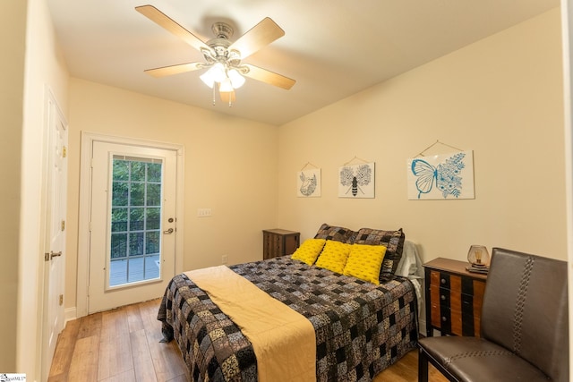 bedroom with ceiling fan and hardwood / wood-style flooring