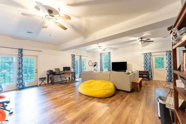 living room with light wood-type flooring and ceiling fan