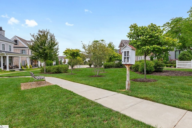 surrounding community featuring a yard