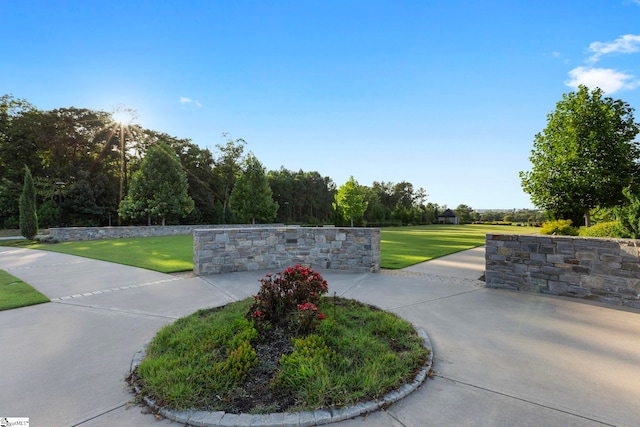 view of property's community with a lawn