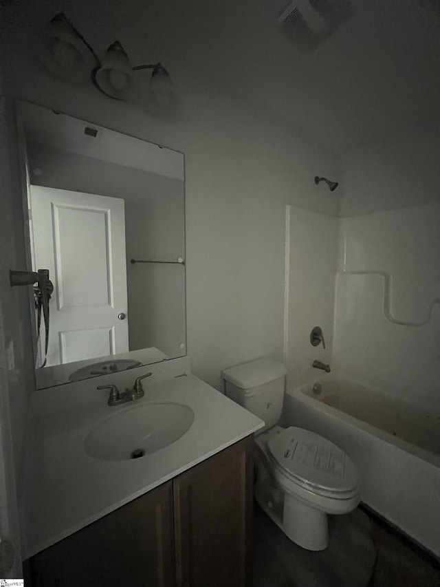 full bathroom featuring vanity,  shower combination, and toilet