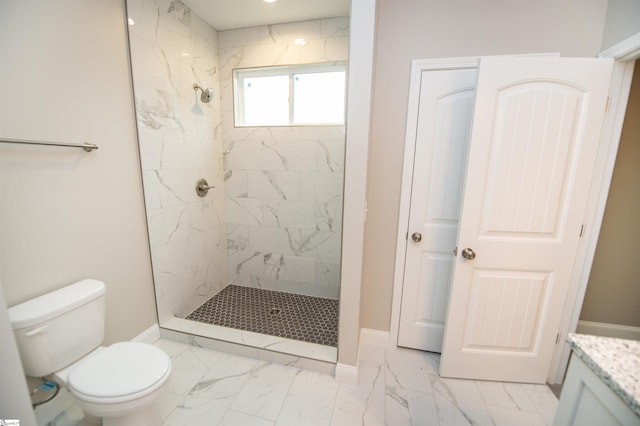 full bath with marble finish flooring, tiled shower, and baseboards
