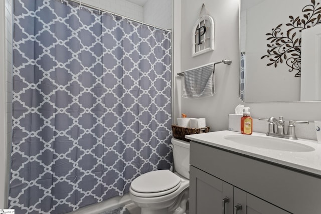 bathroom with vanity, toilet, and a shower with shower curtain