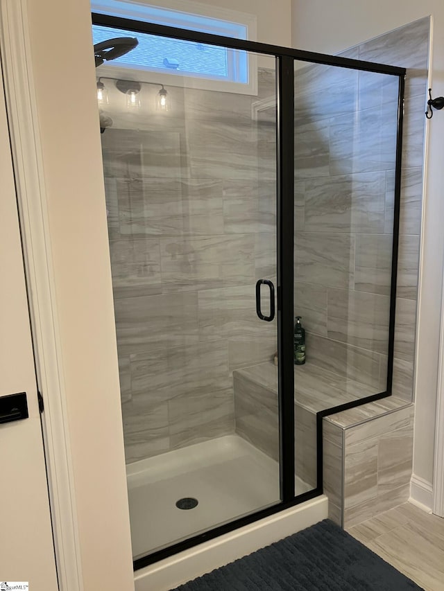 bathroom featuring an enclosed shower