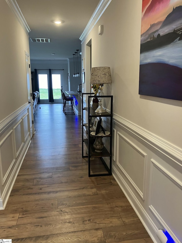 hall with dark hardwood / wood-style floors, french doors, and crown molding