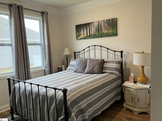 bedroom featuring ornamental molding and dark wood-type flooring