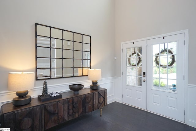 foyer with french doors and dark hardwood / wood-style flooring