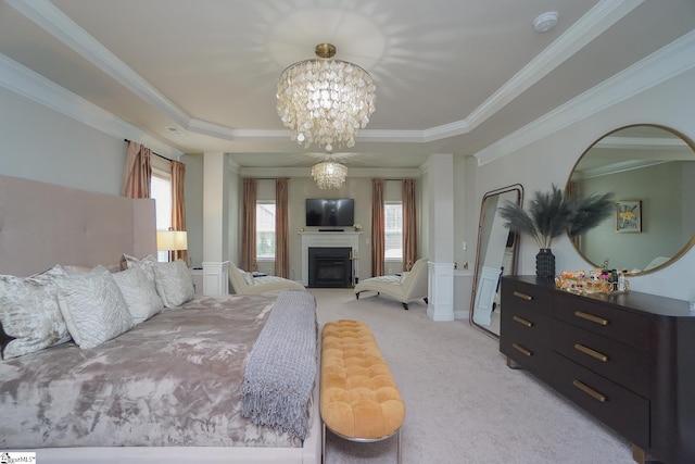 bedroom with multiple windows, ornamental molding, a tray ceiling, and light colored carpet