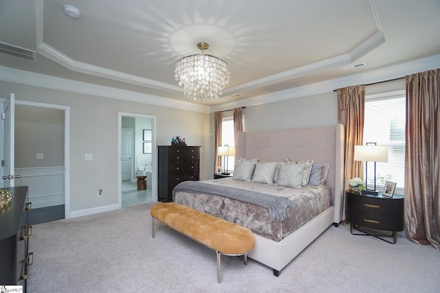 bedroom with a raised ceiling, connected bathroom, an inviting chandelier, carpet, and ornamental molding