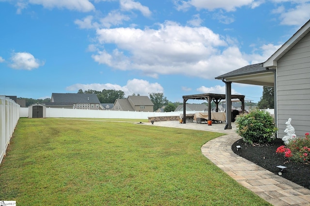 view of yard featuring a patio and a shed