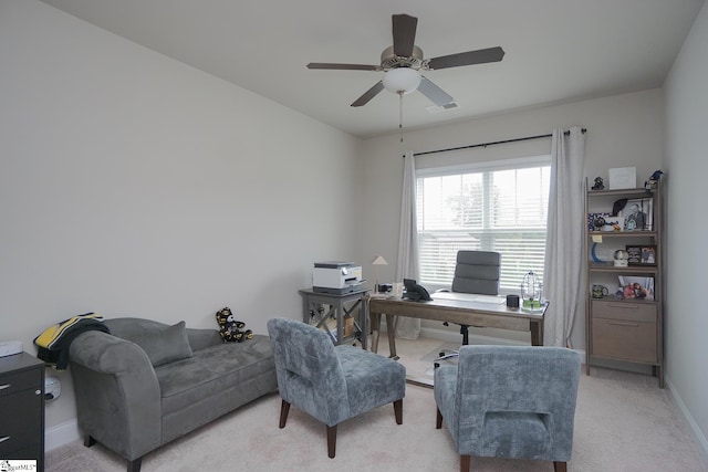 carpeted home office with ceiling fan