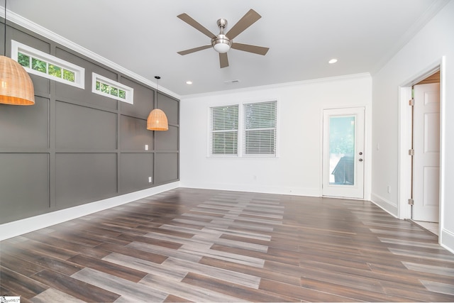 unfurnished room featuring ornamental molding, dark hardwood / wood-style flooring, and ceiling fan