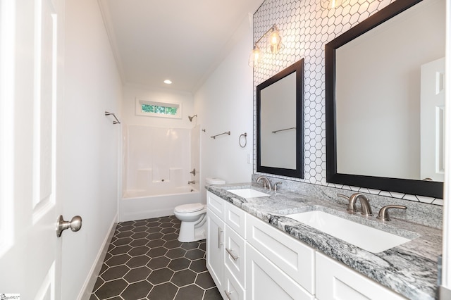 full bathroom with vanity, shower / bathing tub combination, ornamental molding, toilet, and tile patterned floors