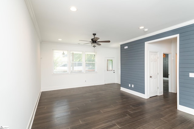 interior space featuring ceiling fan, dark hardwood / wood-style floors, and ornamental molding