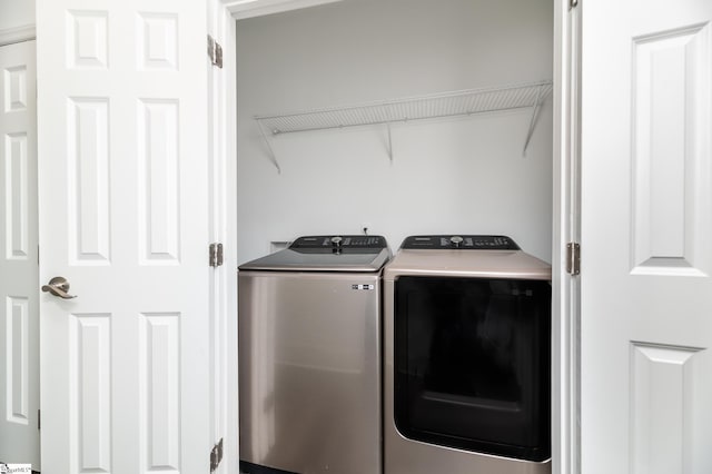 laundry area with independent washer and dryer