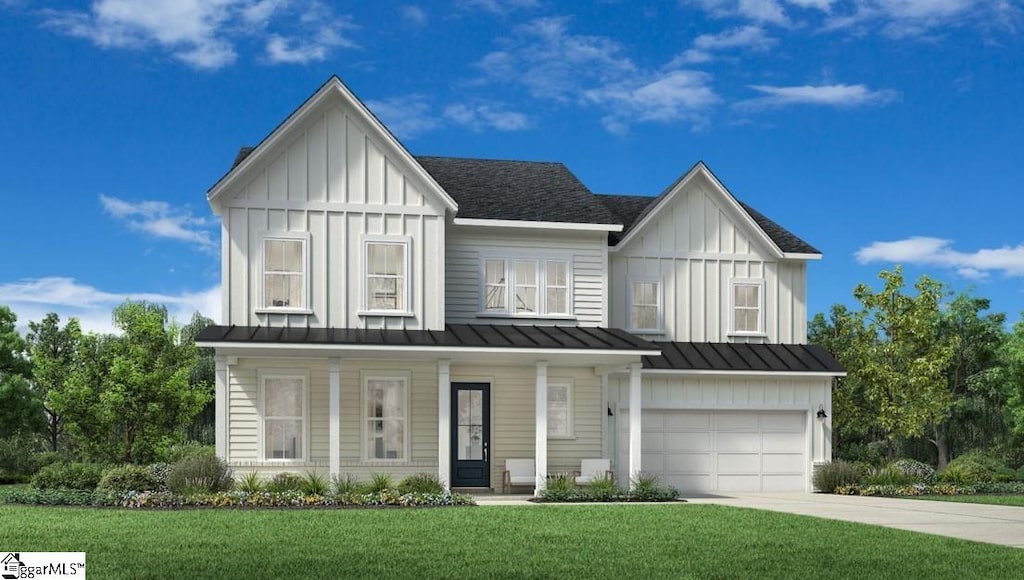 view of front facade with a garage and a front yard