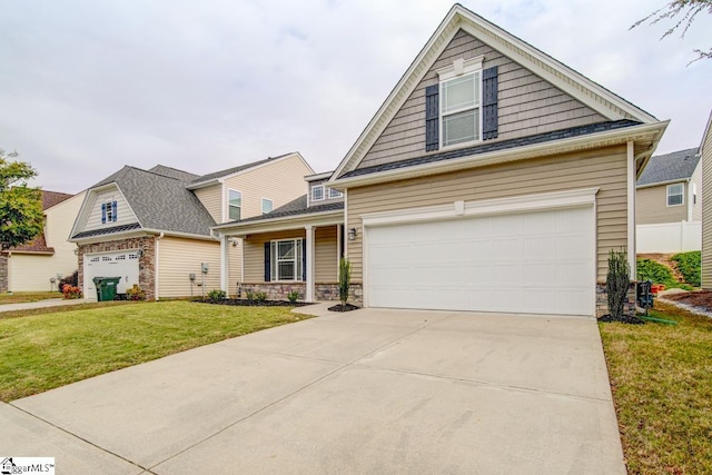 view of front facade featuring a front yard and a garage