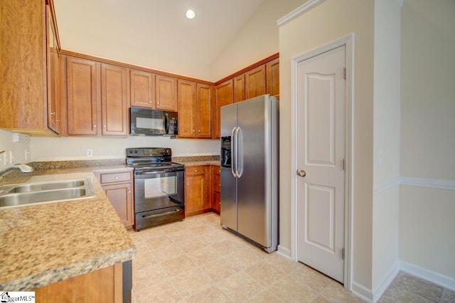 kitchen featuring lofted ceiling, black appliances, and sink