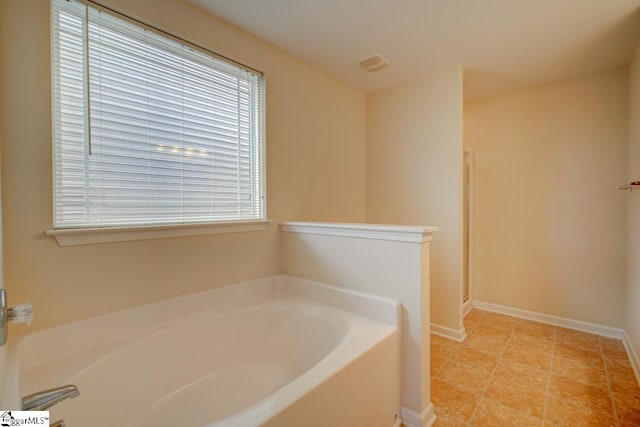 bathroom with separate shower and tub