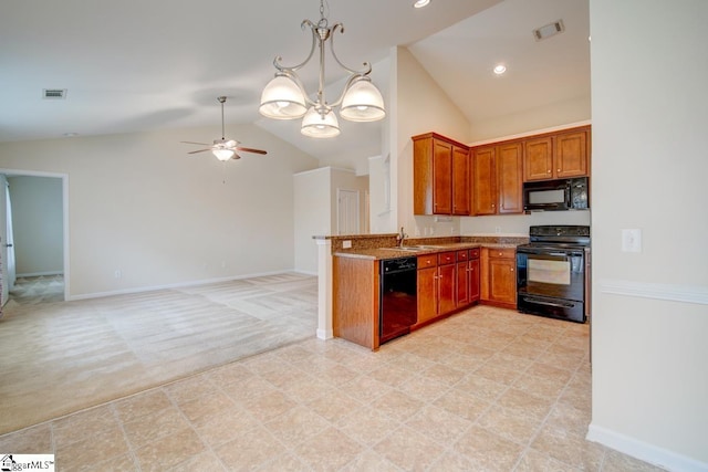 kitchen featuring ceiling fan with notable chandelier, kitchen peninsula, black appliances, sink, and light carpet