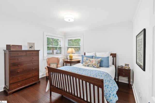 bedroom with ornamental molding and dark wood-type flooring