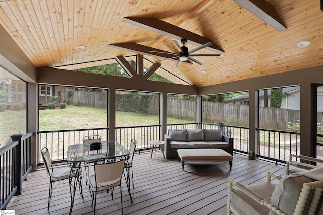 sunroom featuring wood ceiling, vaulted ceiling with beams, and ceiling fan