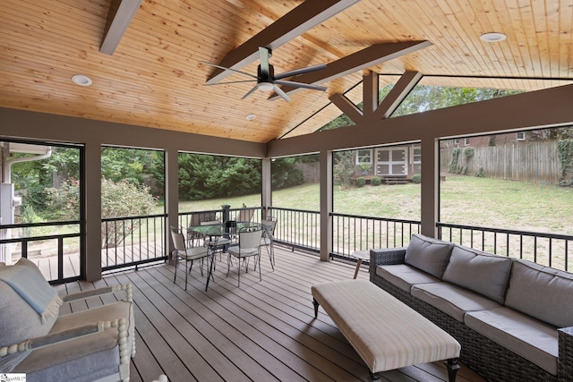 unfurnished sunroom with vaulted ceiling with beams, ceiling fan, and wooden ceiling