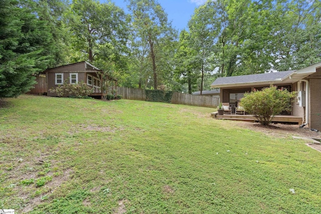 view of yard with a deck