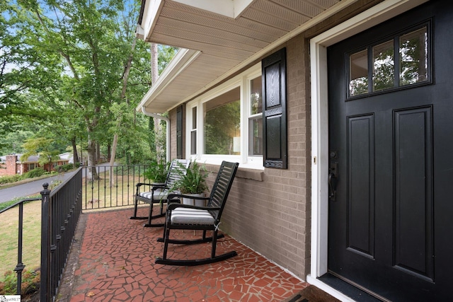 entrance to property featuring a porch