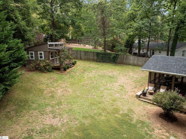 view of yard featuring a wooden deck