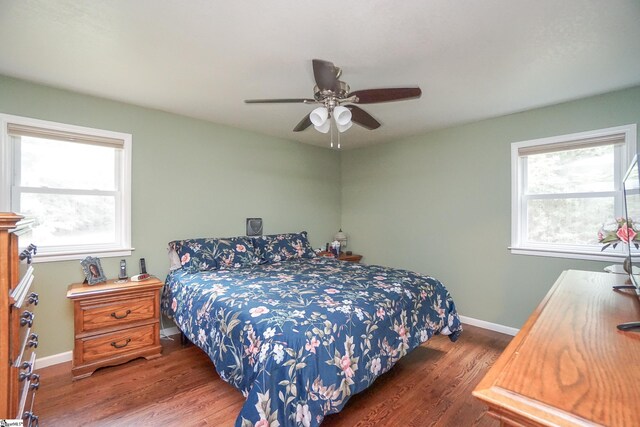 bedroom featuring dark hardwood / wood-style floors and ceiling fan